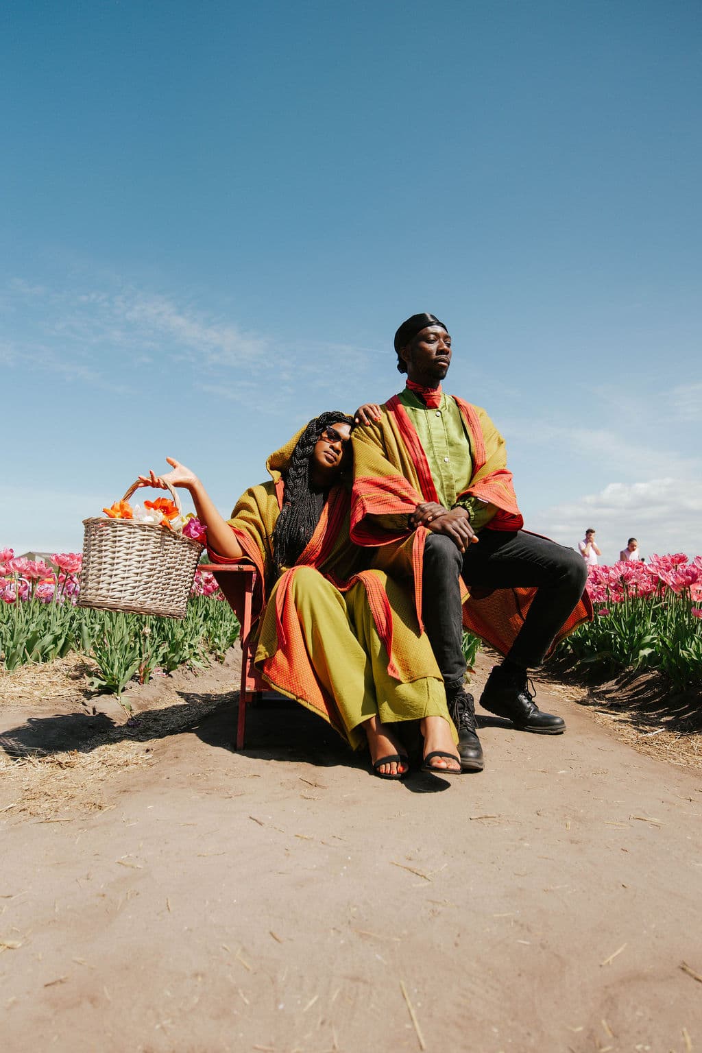 Liquid Lemn editorial — couple in golden kimonos among tulips