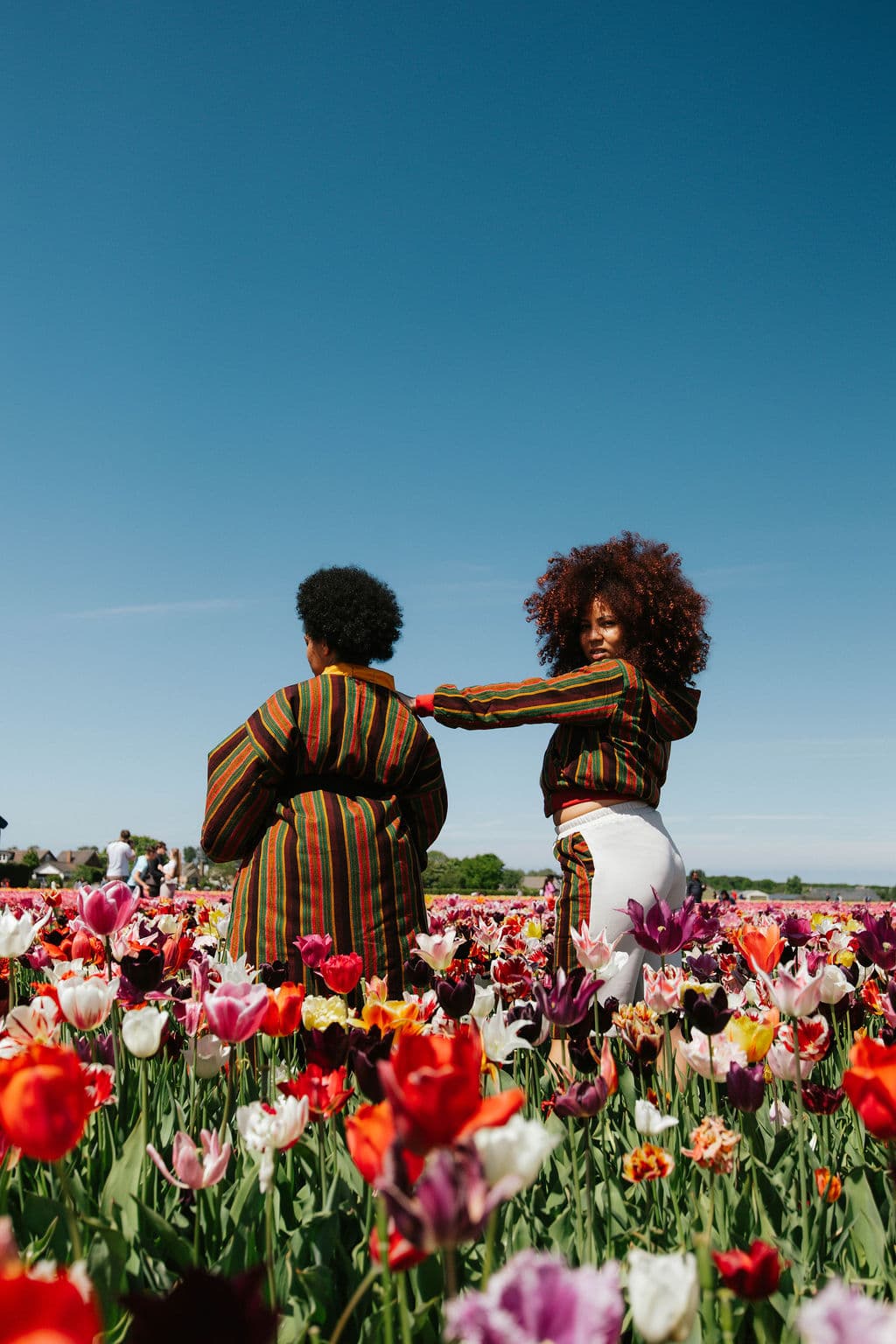 Liquid Lemn editorial — matching striped kimonos in tulip field